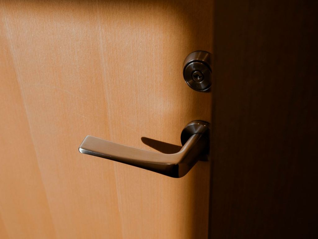 Close-up of a commercial door lever handle and lock