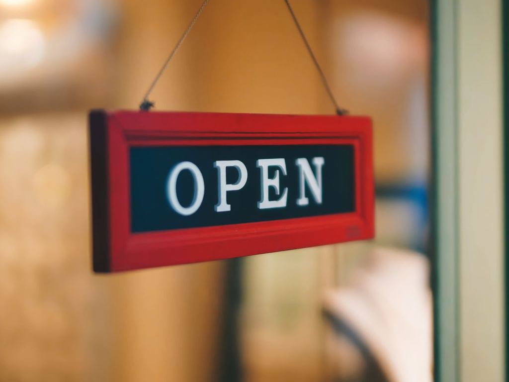 Hanging open sign inside a shop entrance